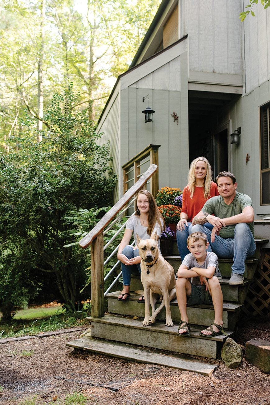 The Goolsby family on their front deck. Their home is part of the historic section of Fearrington (the first part of the neighborhood to be developed).