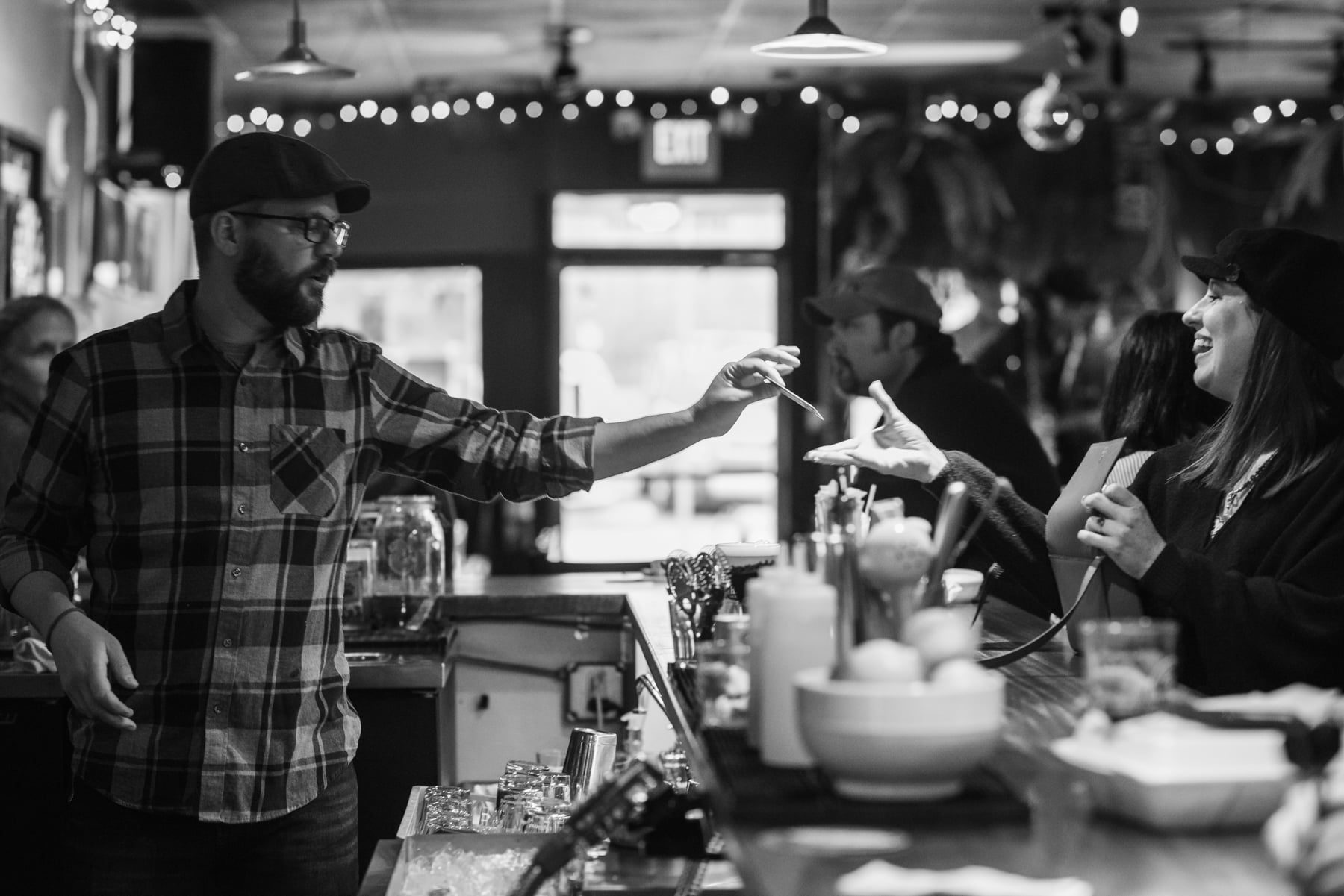 Andrew Bryant, Nash Street's general manager, serves drinks behind the bar.
