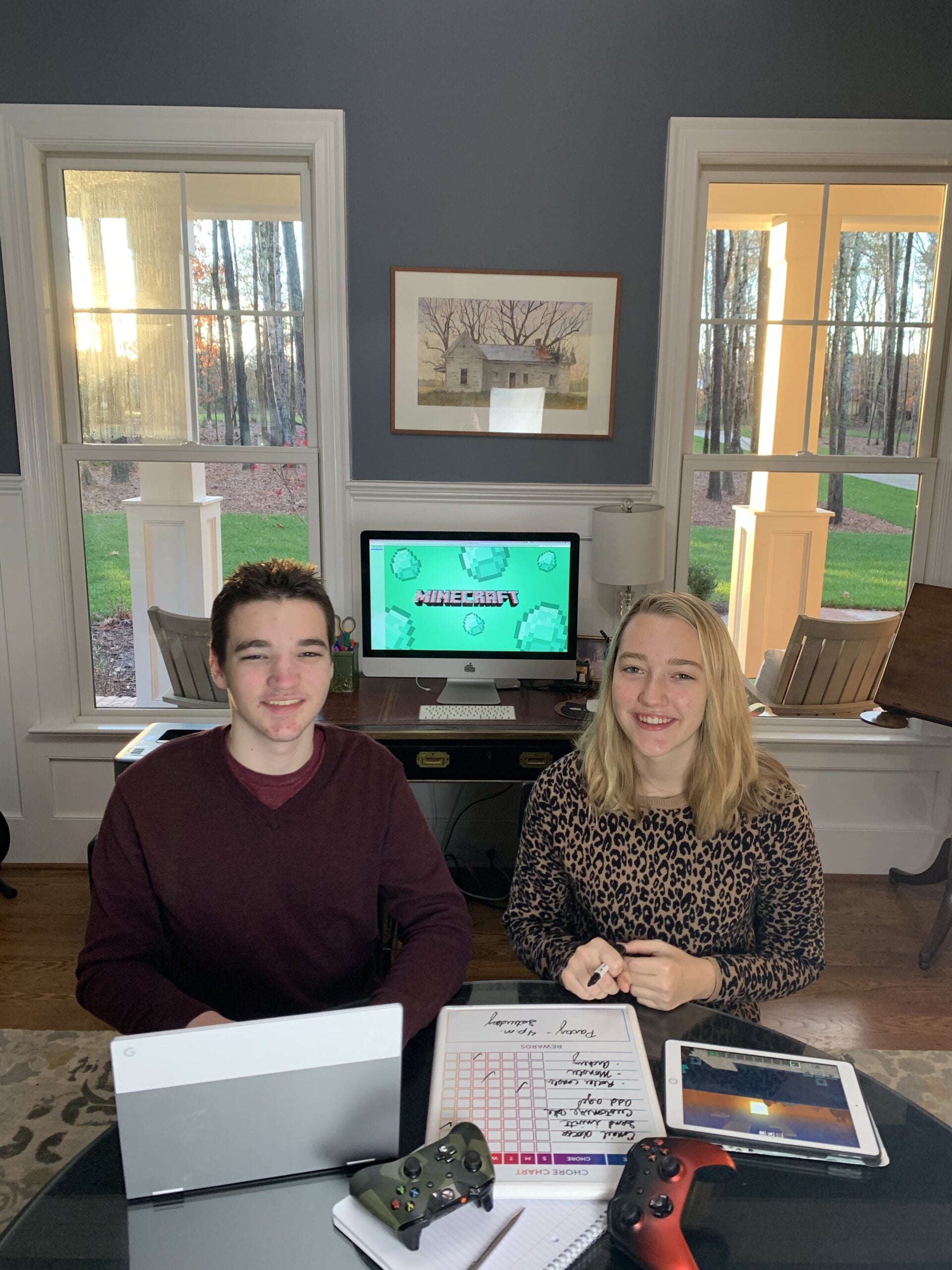 Harrison and Sophie Stanley in front of their Minecraft screen