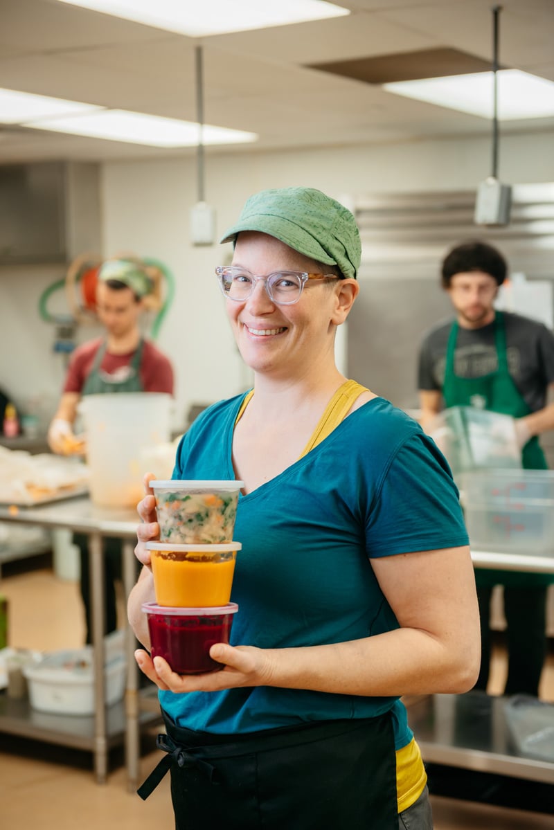 Social entrepreneur Tova Boehm holds up a few Short Winter Soups options
