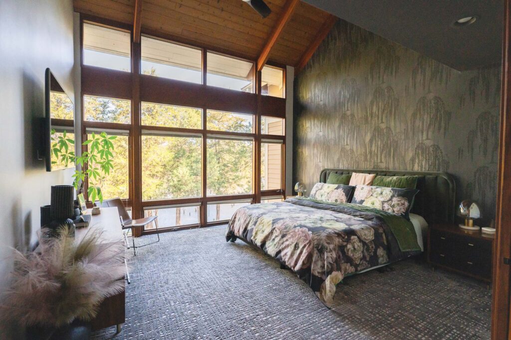 Interior designer Ana Tavares's bedroom with beautiful blooms patterned on the wallpaper.