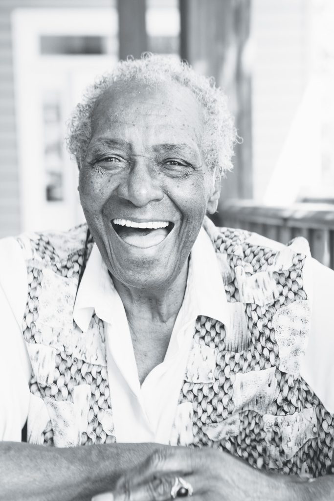 Mildred Council, also known as Mama Dip, smiling in a black-and-white portrait.