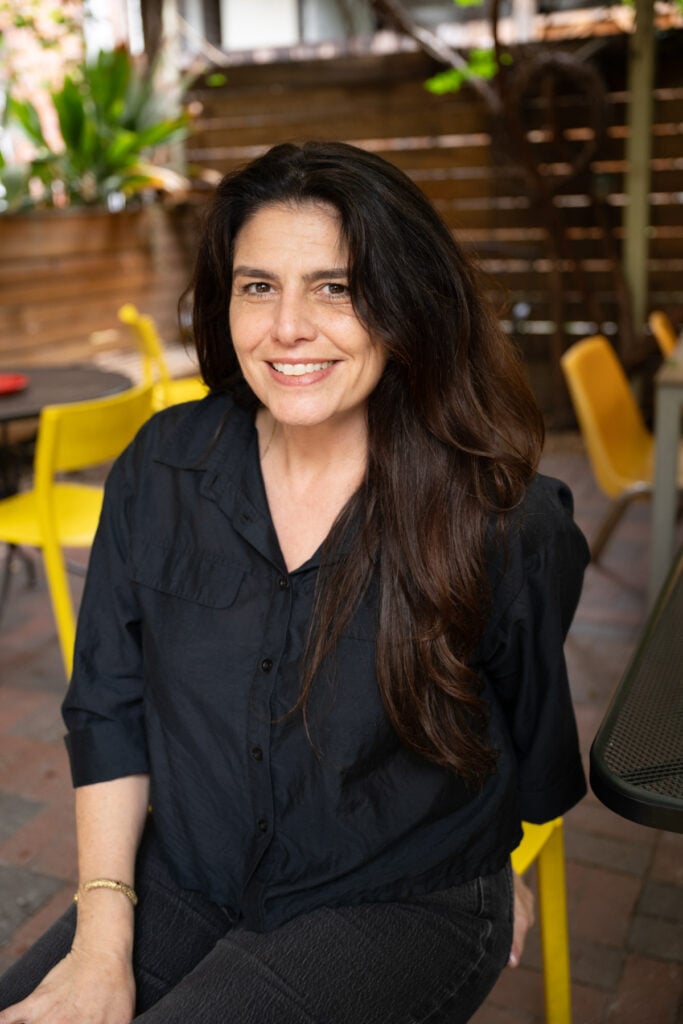 Orange County Tricia Mesigian Social Club owner smiles on the patio