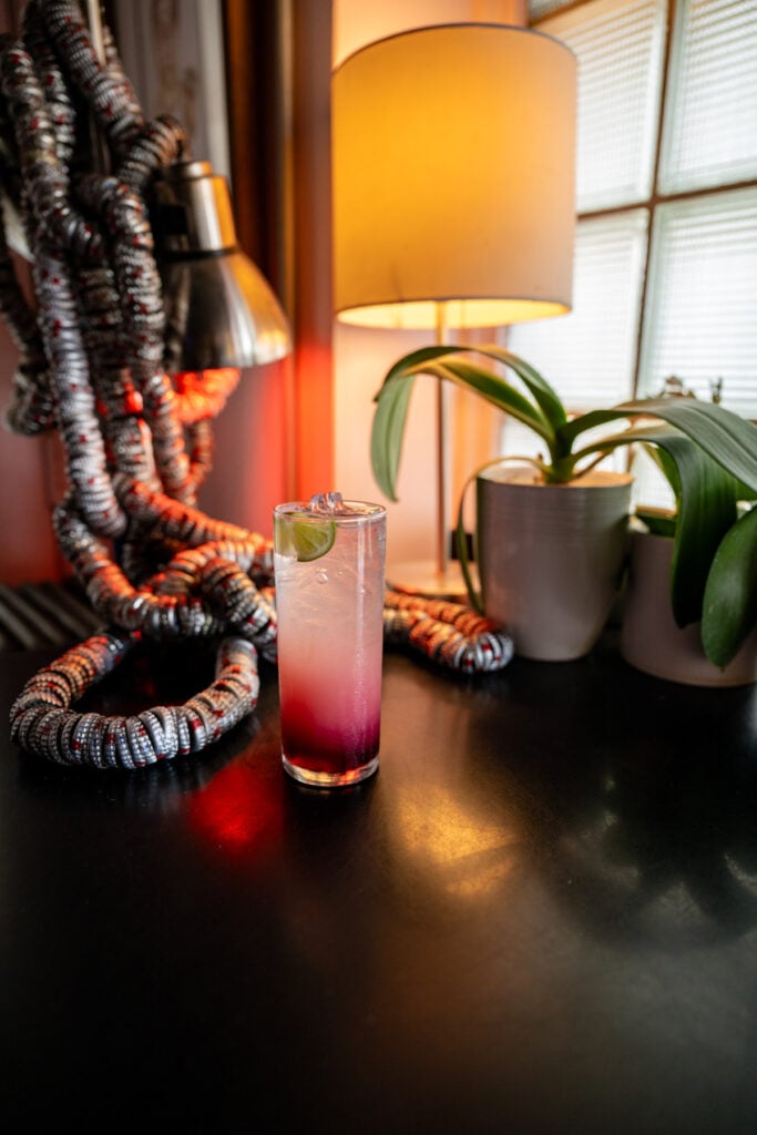 A cocktail sits at a table inside OCSC