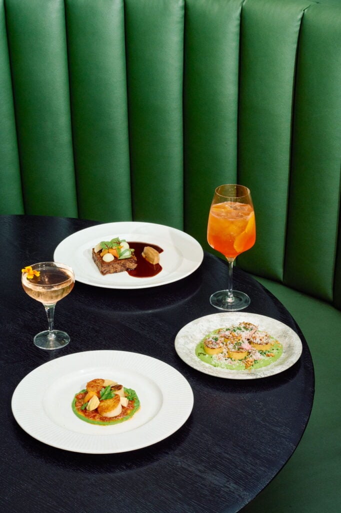 Three Hawthorne and Wood plates with two signature cocktails.